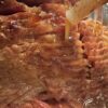 A Sliced Ham being basted
