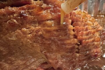A Sliced Ham being basted