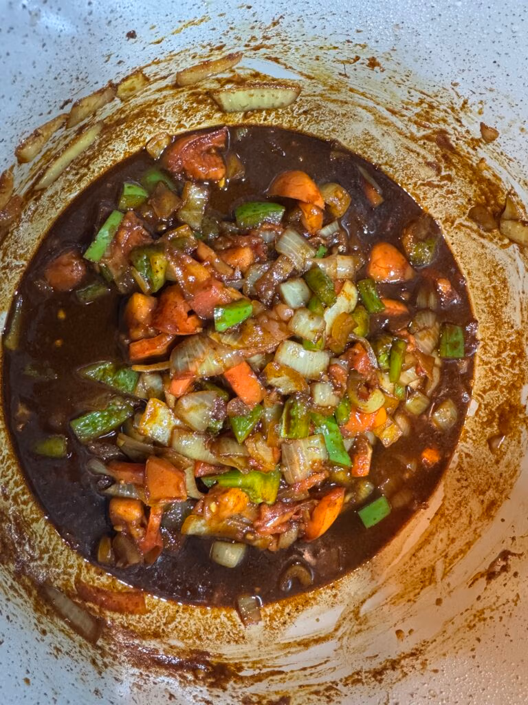 seasonings cooking, bell pepper onion and red bell pepper in instant pot for brown stew beef