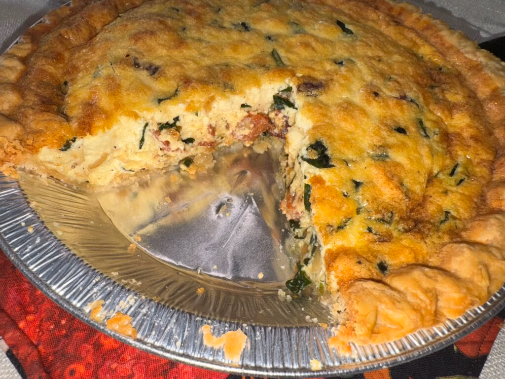 A Quiche with slices missing