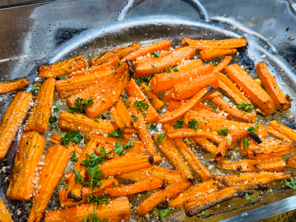 Roasted Carrots on a tray garnished with Parsley