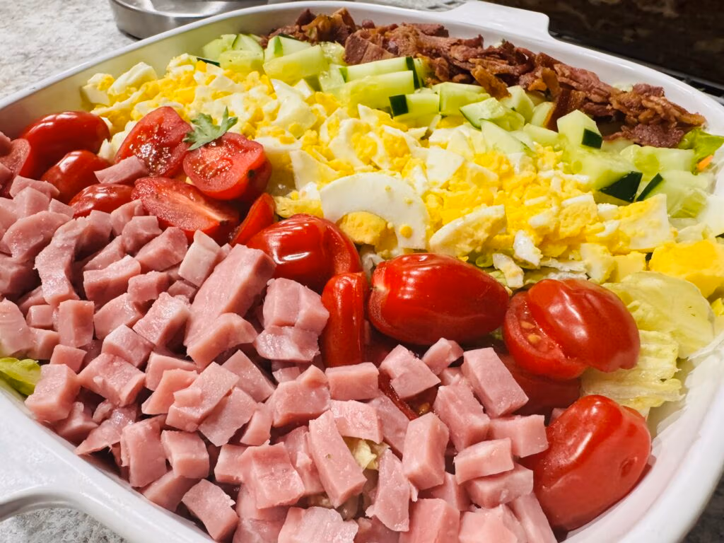 Cobb Salad with Chopped Ham Egg Tomato Bacon and Cucumber