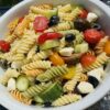 tri color rotini pasta salad with olives feta cheese tomato and cucumber