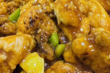 Sweet and Sour Chicken Dinner with pineapple and Chopped Green Peppers