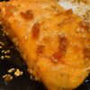 a portion of teriyaki salmon with sesame seeds