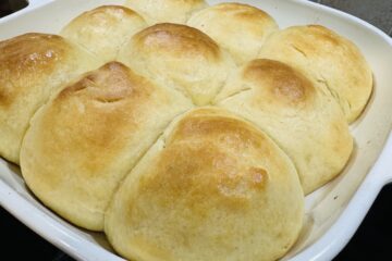 golden homemade dinner rolls fresh from the oven