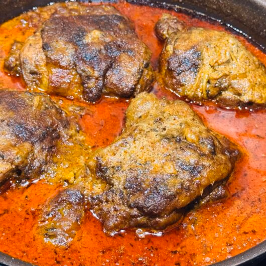 chicken paprikash a briased flavorful chicken in a tomato and paprika stew