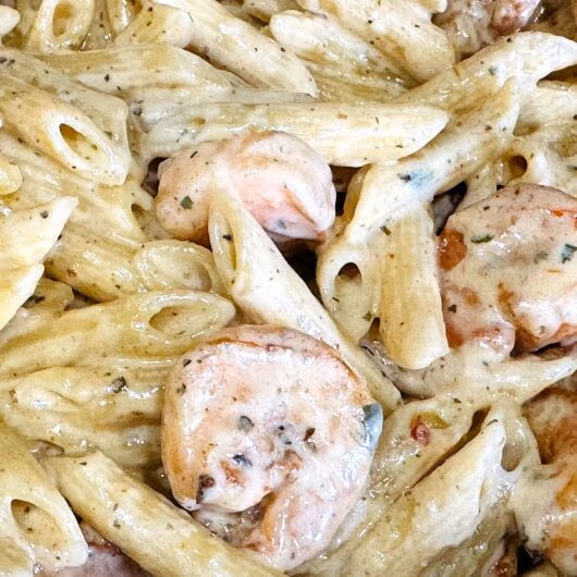 A close up of creamy Shrimp Alfredo with Penne Pasta