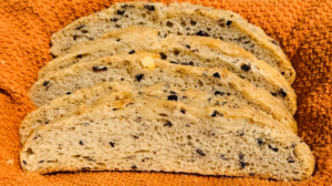 Olive and Feta Bread Sliced showing roasted olives and feta cheese inside