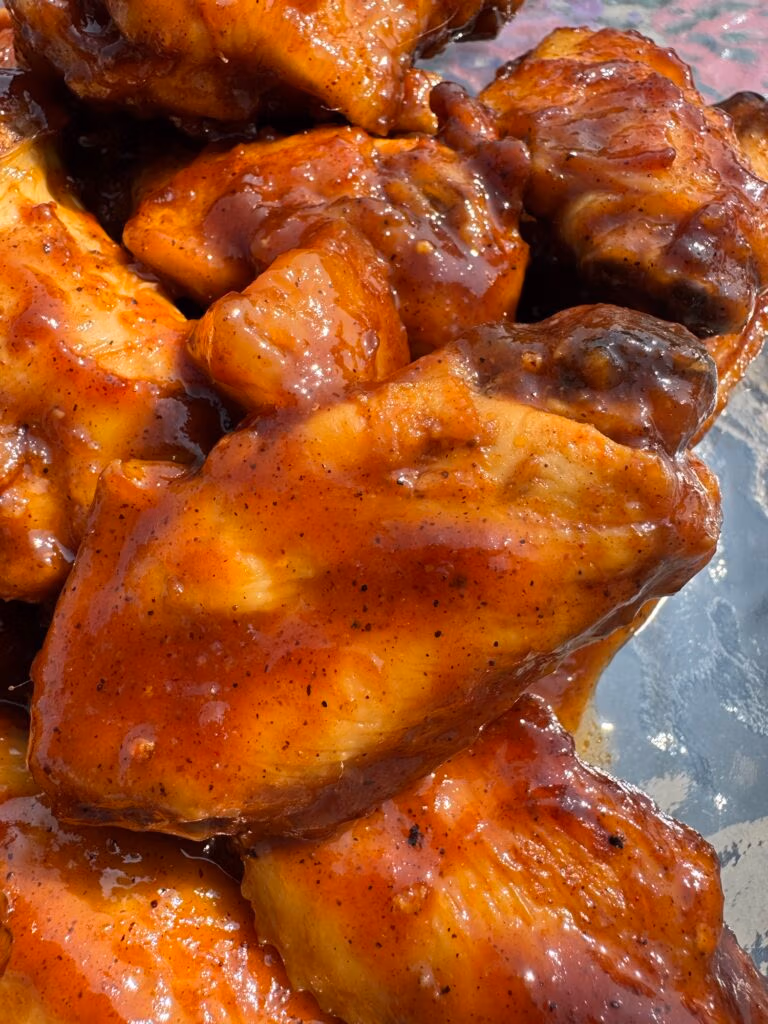 close up of brown brown sugar pineapple glazed chicken wings