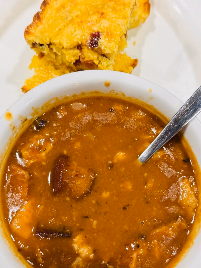 a bowl of 15 bean ham soup next to maple bacon cornbread
