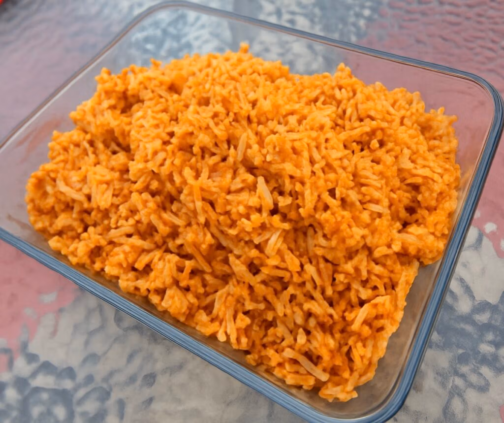 A clear serving pyrex of homemade mexican rice