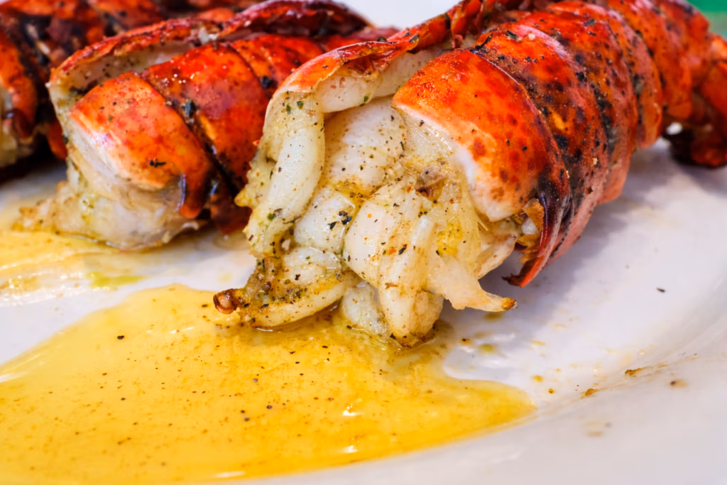 Grilled lobster tails smothered in garlic butter